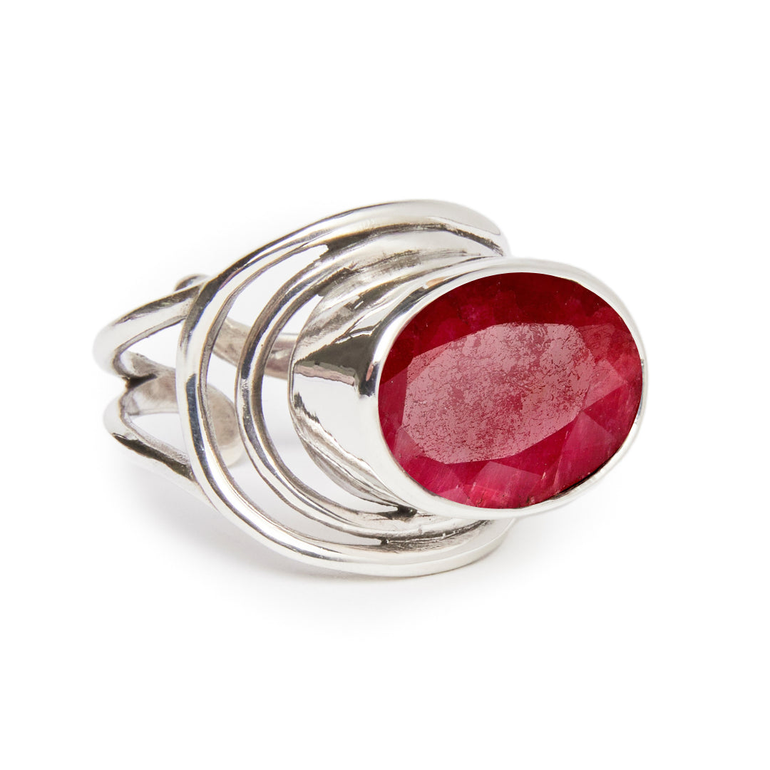 The Party Ring by Gallardo & Blaine Designs features a bold, oval-shaped red gemstone centerpiece with multiple intertwined sterling silver bands.
